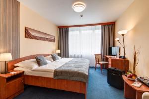 Posteľ alebo postele v izbe v ubytovaní LC - Hotel Ostrava