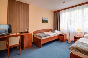 Posteľ alebo postele v izbe v ubytovaní LC - Hotel Ostrava