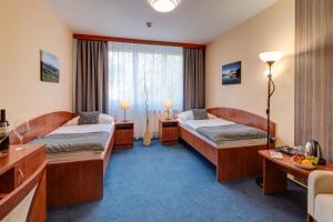 Posteľ alebo postele v izbe v ubytovaní LC - Hotel Ostrava