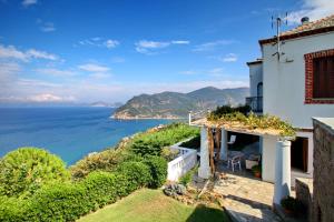 a house with a view of the ocean at Stolios in Skopelos Town