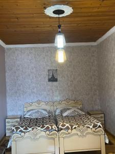 Postel nebo postele na pokoji v ubytování Guest House Latali