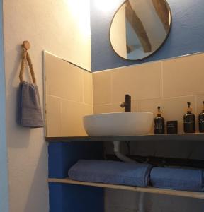 a bathroom with a sink and a mirror at Casa Carrie in Válor +18 photos