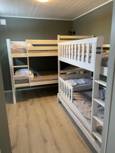 a room with two bunk beds in a room at Bränntorps Gård in Kolmården