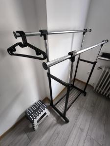a metal rack in a corner of a room at Golden Dragon Guesthouse in Dossenheim
