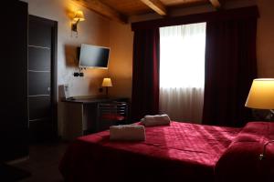 Postel nebo postele na pokoji v ubytování Hotel Paradiso