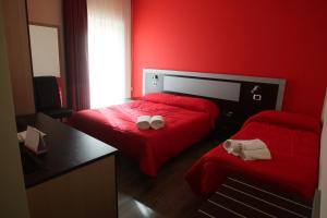 Postel nebo postele na pokoji v ubytování Hotel Paradiso