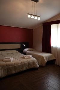 Postel nebo postele na pokoji v ubytování Hotel Paradiso