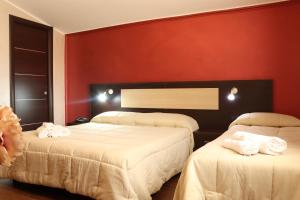 Postel nebo postele na pokoji v ubytování Hotel Paradiso