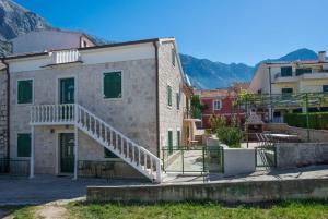 a building with a staircase in front of it at TerraMar Apartments in Baška Voda