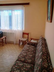 a bedroom with two beds and a window at Vila Codrin in Iaşi
