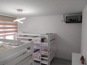 Postel nebo postele na pokoji v ubytování DM Hostel and Apartments