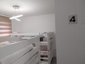 Postel nebo postele na pokoji v ubytování DM Hostel and Apartments