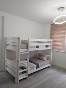 Postel nebo postele na pokoji v ubytování DM Hostel and Apartments
