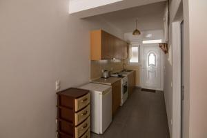 a small kitchen with a sink and a stove at Faliraki Dream Apartments & Studios in Kallithea Rhodes