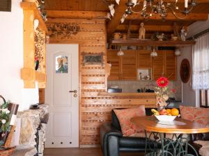 a living room with a couch and a table at Domek myśliwski na wsi in Przemyśl