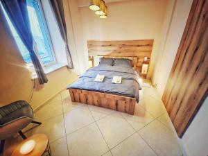 a bedroom with a bed with two towels on it at Summer Apartment in Przemyśl
