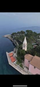 an aerial view of a building on an island in the water at Hotel Heritage in Veli Lošinj