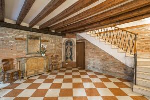 a room with a stairway leading up to a staircase at Palazzo Guardi in Venice