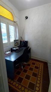 a room with a desk and a window at Casa Triada in Montevideo