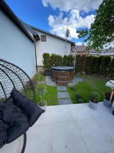 a view of a backyard with a hot tub in the yard at AURA Hlinsko in Hlinsko