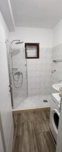 Kúpeľňa v ubytovaní Apartments Kapetanovi Dvori