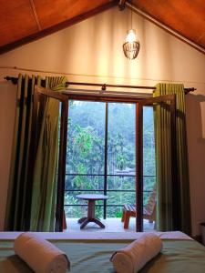 Postel nebo postele na pokoji v ubytování Sunshine Forest Lodge - Sinharaja