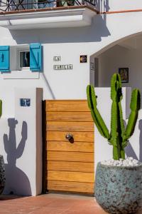 a cactus in a pot in front of a door at La Familia Beach House La Cala in La Cala de Mijas