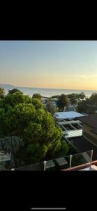 a view of a city with trees and a building at Pool Rooftop Kadikoy Bagdat St. Seaside metro 5mins Metro in Istanbul