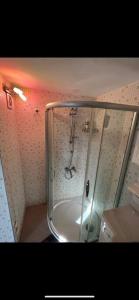 a shower with a glass enclosure in a bathroom at Pool Rooftop Kadikoy Bagdat St. Seaside metro 5mins Metro in Istanbul