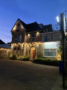 a house with lights on the front of it at Rock House Bed and Breakfast in Maidstone