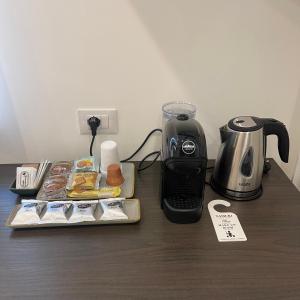 a counter top with a coffee maker and a blender at Namuri Luxury Rooms in Taormina