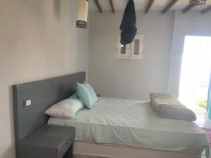 a bed with two pillows on it in a bedroom at Ziena marvel camp in Quseir