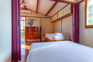 a bedroom with two beds and a window at Midori-an 緑庵 - The Garden in Maglie