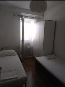 Postel nebo postele na pokoji v ubytování Apartments Lorio