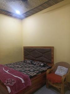 Katil atau katil-katil dalam bilik di Shrihit RadhaMohan Dham