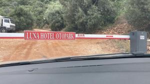 a sign that says uk hotel operator on a road at Yoga House Kaş in Kaş