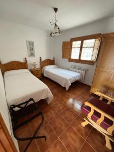 En eller flere senge i et værelse på El Olivo
