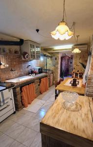 a kitchen with a table and a counter top at In Battaglino in Cascina