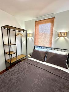 a bedroom with a large bed and a window at Aqua Vita Concept in Bihać +34 photos