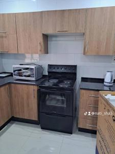 a kitchen with a stove and a toaster oven at 11036 in Ndola