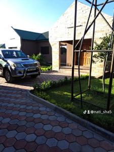 a car parked in front of a house at 11036 in Ndola