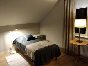 Ένα ή περισσότερα κρεβάτια σε δωμάτιο στο Korsnäsgården