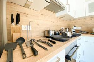 a kitchen with a counter with utensils on it at 320 Lux Furnished flat in Beaufort