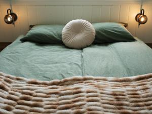 Ein Bett oder Betten in einem Zimmer der Unterkunft Vík Hostel