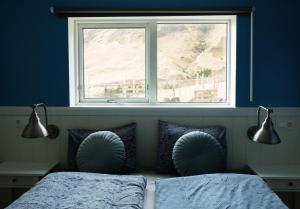 Ein Bett oder Betten in einem Zimmer der Unterkunft Vík Hostel