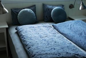 Ein Bett oder Betten in einem Zimmer der Unterkunft Vík Hostel