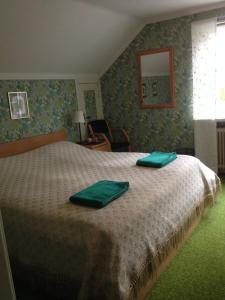 Säng eller sängar i ett rum på Marielund Gård