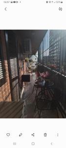 a balcony with a table and chairs on a building at Los nietos alojamiento céntrico in San Miguel de Tucumán