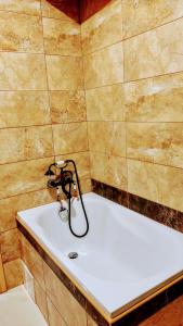 a bathroom with a tub and a sink at Jílová tvrz in Rožmberk nad Vltavou