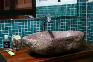 a stone sink on a counter in a bathroom at Casa 2 in Namibe